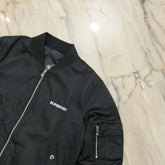 Black Burberry jacket on a marble surface